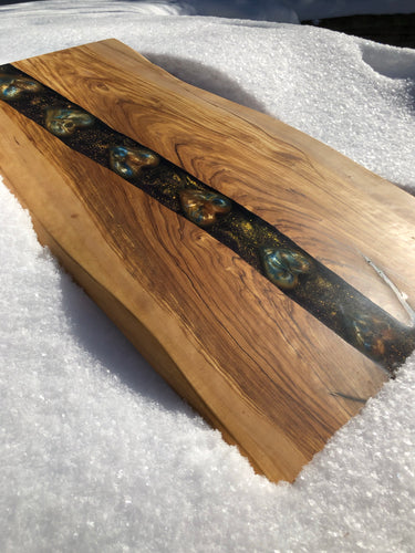 Color changing olive wood serving board