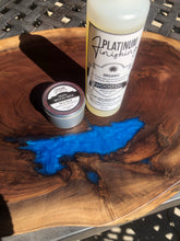 Load image into Gallery viewer, Circular walnut board with blue epoxy